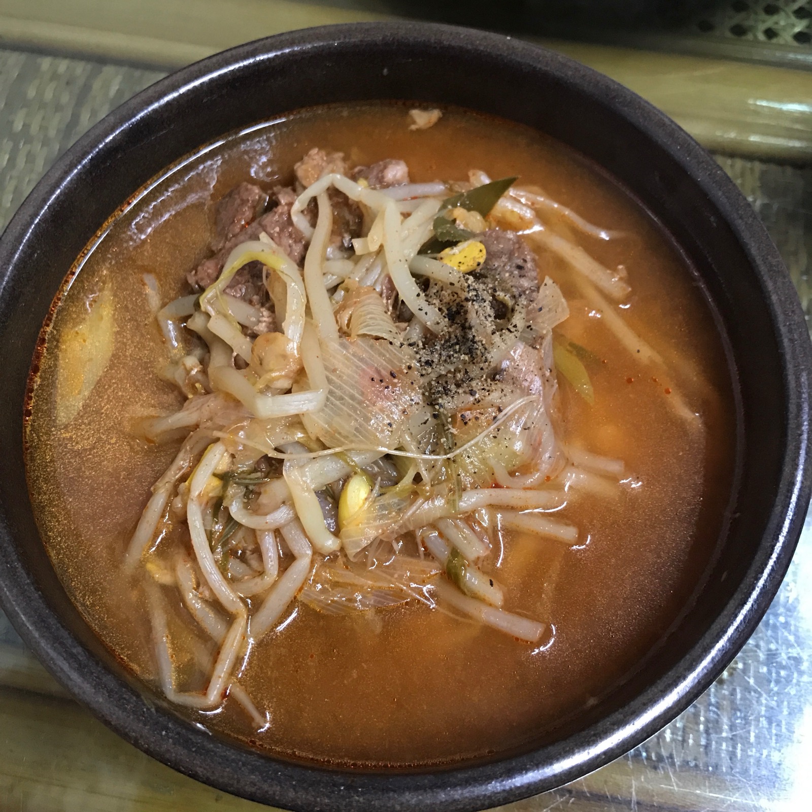 A hot Korean rice soup served with beef and broth