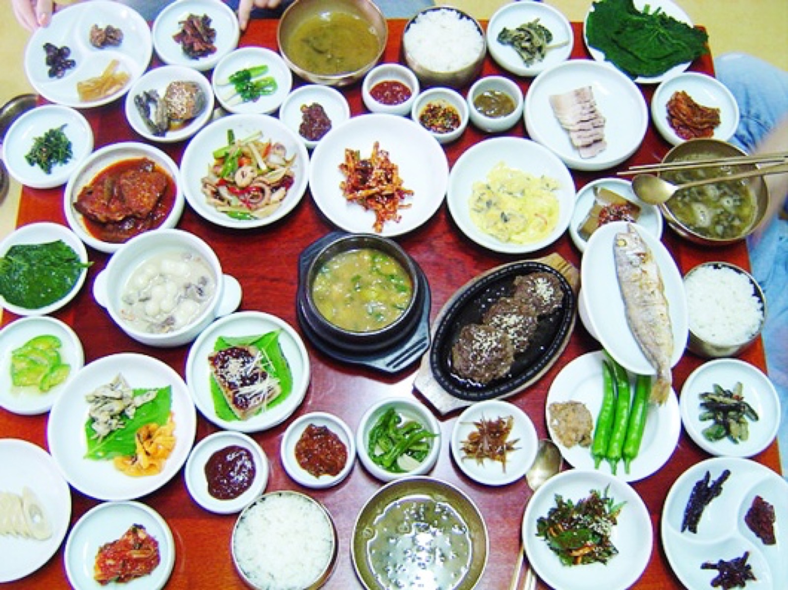 A traditional Korean course meal table with many small dishes